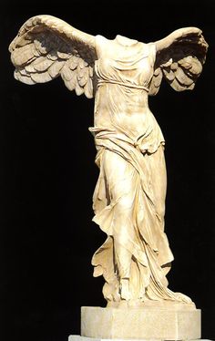 a statue of an angel with outstretched wings