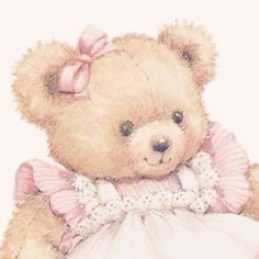 a brown teddy bear wearing a pink dress