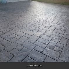 an outdoor patio with stone pavers and brick flooring that looks like it has been cleaned