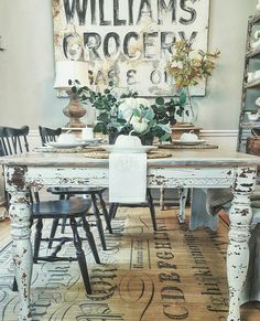 a dining room table and chairs in front of a sign that says williams crockery