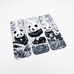 three pandas are sitting on bamboo trees and one is holding onto something with its paws