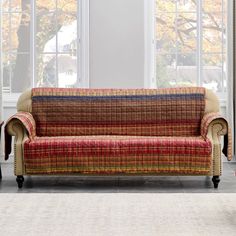 a living room filled with furniture and windows