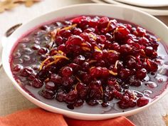 cranberry sauce in a white bowl with orange peels