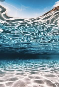 the water is very clear and blue with some waves coming up on it's surface