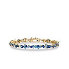 Discover timeless elegance with Sydney Evan's exquisite fine jewelry collection. This stunning tennis bracelet is crafted with meticulous attention to detail from 14k yellow gold, adorned with captivating blue sapphires and dazzling diamonds. The bracelet measures 6.75" in length, perfectly accentuating your wrist with a touch of sophistication. Elevate any ensemble with this exquisite piece that effortlessly combines classic style and modern allure. Explore Sydney Evan's fine jewelry ... Sapphire Bracelet Gold, Blue And Yellow Jewelry, Blue Tennis Bracelet, Something Blue Bracelet, Yellow Gold Sapphire Jubilee Bracelets, Blue And Gold Bracelets, Gold Sapphire Tennis Bracelet, Yellow Gold Sapphire Diamond Bracelet In Fine Jewelry Style, Yellow Gold Sapphire Diamond Bracelet