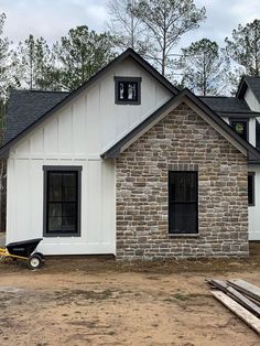 a brick house is being built in the woods