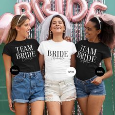 three brides wearing matching t - shirts with the word team bride printed on them