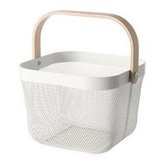 a white basket with a wooden handle