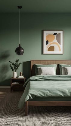 a bed with green sheets and pillows in a room painted in farrowy tones