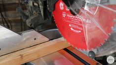 a circular saw is being used to cut wood