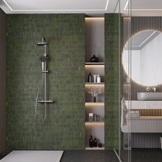 a modern bathroom with green tiles on the walls and floor, along with a walk in shower