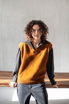 "A knitted sweater vest is one of the wardrobe foundation pieces you should own as it will be your go-to as soon as the temperatures drop. Made from 100% Merino wool, this incredible soft and quite lightweight vest will keep you toasty and comfortable. The oversized silhouette looks perfect on a loose-fitting shirt, blouse, or a short-sleeve T-shirt. Play with different textures and neutral colors to create a wide range of put-together looks, regardless of the occasion and season. If Merino wool Lightweight Vest, Slow Fashion Brands, Merino Wool Sweater, Elegant Shirt, Oversized Silhouette, Sleeveless Sweater, Oversized Sweater, Knit Vest, Womens Vest