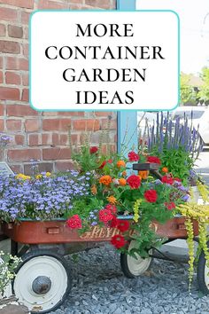 a wagon filled with flowers sitting in front of a brick building next to a sign that says more container garden ideas