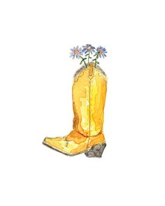 a yellow cowboy boot with blue flowers in it