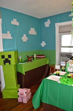 a room decorated for a minecraft birthday party