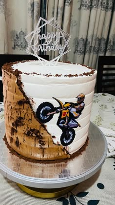 a birthday cake with a dirt bike on it