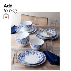 blue and white dinnerware set on a wooden table