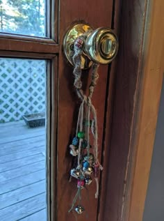 a door handle with beads hanging from it