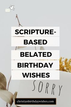 a birthday card with the words sorry written on it and flowers in front of it