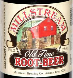 an old time root - beer bottle with a red barn in the background and words mill stream on it