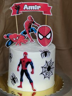 a spiderman birthday cake on a plate