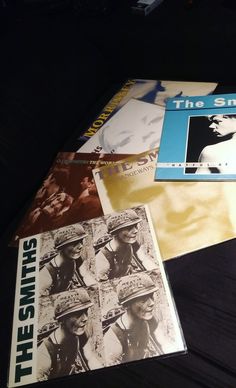 the smiths album covers are laying on top of each other