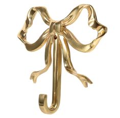 a gold brooch with a bow on it