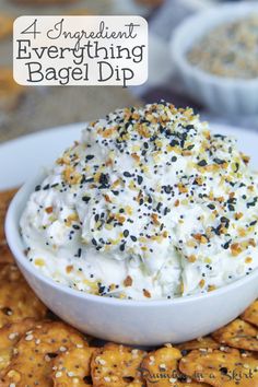 a white bowl filled with whipped cream surrounded by crackers on a plate and text overlay that reads, 4 ingredient everything bagel dip