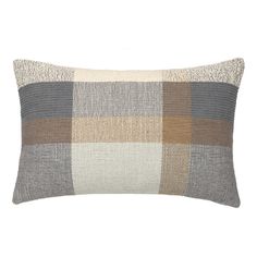 a gray and tan plaid pillow on a white background