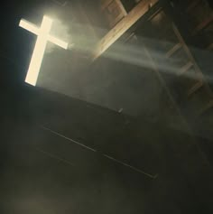 the cross is shining brightly in the dark