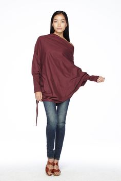 "🚚..ALL ORDERS ARE SHIPPED VIA DHL EXPRESS MAIL This batwing tunic is a very \"cool\" addition to any wardrobe! With a unique drawstrings on bottom hem of tunic provide plenty of options for changing the look. Cowl neckline, batwing sleeves with wide cuffed and oversized side pocket; can be worn layered over leggings, pants, or skirt for even more dramatic effects. * Pull-on style * Cowl neckline * Dropped shoulders * Long sleeves with wide ribbed cuff * Oversize side pocket * Asymmetrical hem Long Sleeve Lagenlook Top, Chic Batwing Sleeve Tops For Fall, Winter Plain Top With Asymmetrical Hem, Fall Tops With Asymmetrical Hem, Solid Color Fall Tops With Asymmetrical Hem, Oversized Tops With Asymmetrical Hem For Fall, Oversized Long Sleeve Tunic For Fall, Chic Winter Tops With Asymmetrical Hem, Chic Asymmetrical Hem Winter Tops