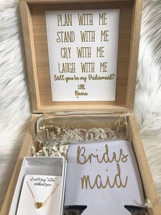 the bride's maid gift box includes two necklaces and a card