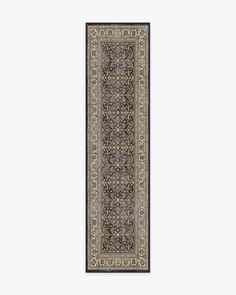 a long rug with an intricate design on the bottom and sides, in grey tones