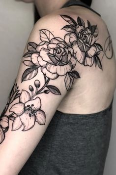 a woman's arm with flowers on it