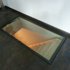 an open window on the ground in a room