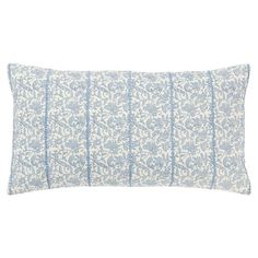 a blue and white pillow on a white background