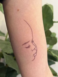 a woman's arm with a small tattoo on the left side of her body