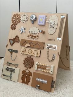 a wooden board with lots of different items attached to it on top of a carpeted floor