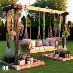 an outdoor swing chair with pillows and potted plants in the grass, next to some wooden planters