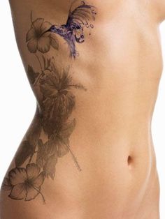 a woman's stomach with flowers on it