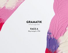 the back side of an ipad with pink and purple leaves on it, next to a white sheet of paper that says grammatik