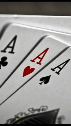 playing cards are arranged on top of each other