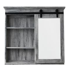 an open bookcase with a mirror on the top and bottom shelf, next to a white sheet of paper