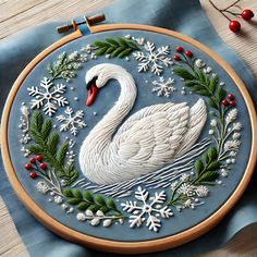 a white swan with holly wreaths and snowflakes on it's back