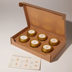 six candles in a box with instructions on the inside