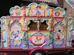 an elaborately decorated bus is parked in front of a building