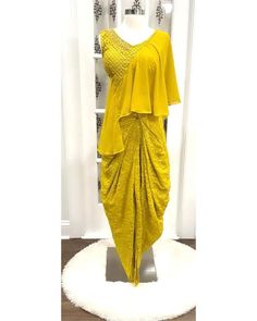 Elevate your style quotient with this Stylish Party Wear Indo-Western Top with Dhoti, perfect for Haldi ceremonies and other special occasions. Embrace the beauty of mirror and embroidery work while staying comfortable and fashionable. Order now and stand out . Size: 38 Product Name: Stylish Party Wear Indo-Western Top with Dhoti - Perfect for Haldi & Special Occasions Description: Make a fashion statement with our exquisite Party Wear Indo-Western Top paired with Dhoti, specially designed for Haldi ceremonies and other special occasions. The top features stunning mirror and embroidery work that adds a touch of elegance and vibrancy to your ensemble. Crafted for comfort and style, this outfit combines tradition with contemporary fashion effortlessly. The set includes a beautifully adorned Dhoti Style Dresses For Haldi, Indo Western Haldi Outfit, Western Dhoti Outfits, Yellow Dhoti Saree For Haldi, Crop Top With Dhoti, Short Top Designs, Western Top, Function Dresses, Partywear Dresses