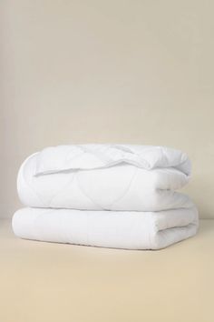 two white sheets stacked on top of each other