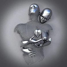 two silver metal figures hugging each other