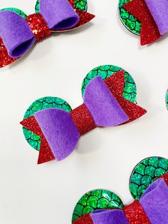 Looking for a cute hair accessory for your next trip to Disney?! Check out this handmade hair bow inspired by The Little Mermaid. It's approximately 3 1/4" wide and can be clipped onto any available hardware.